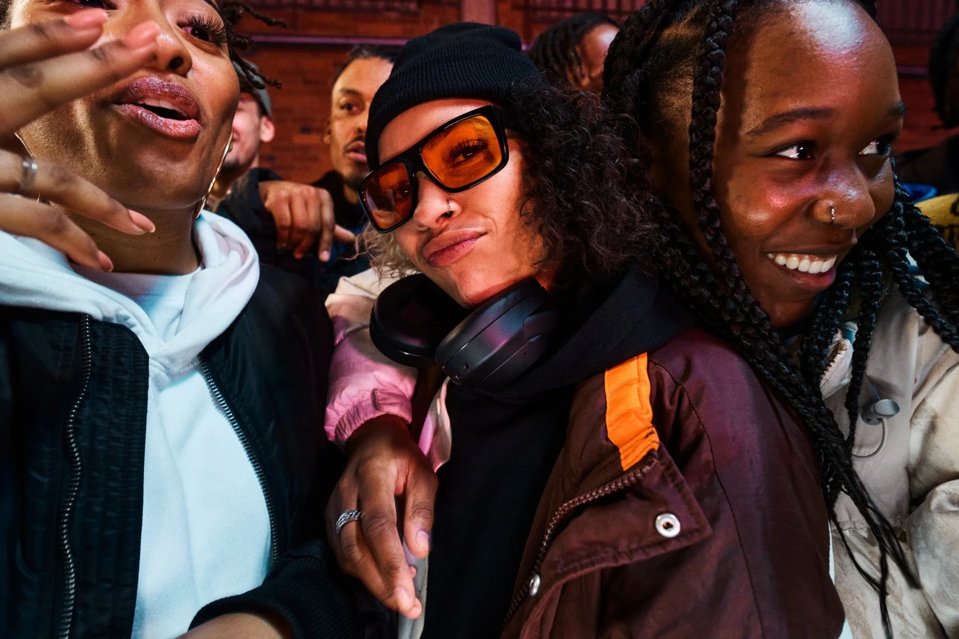Group of friends with Sony headphones and sunglasses