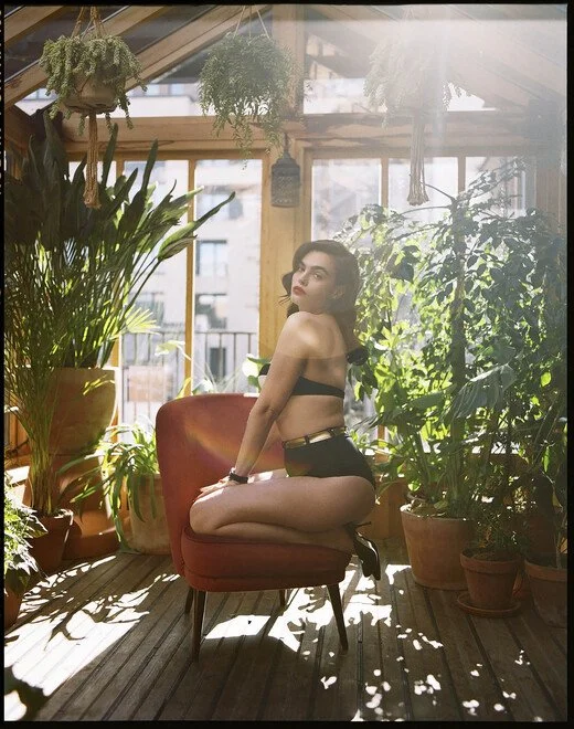 Charli Howard portrait in greenhouse by Liam Arthur